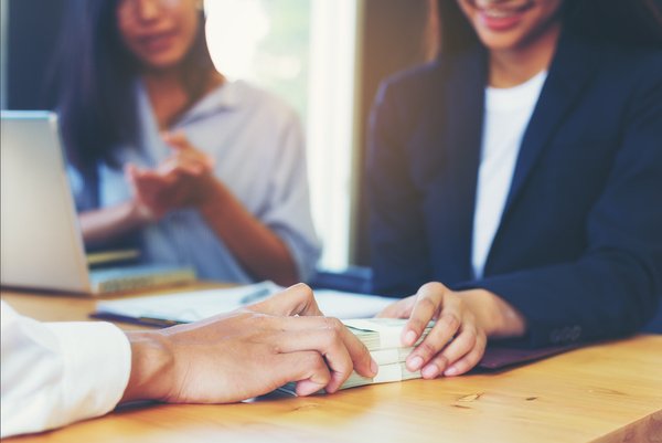 Business Woman Signing a Loan for Investment